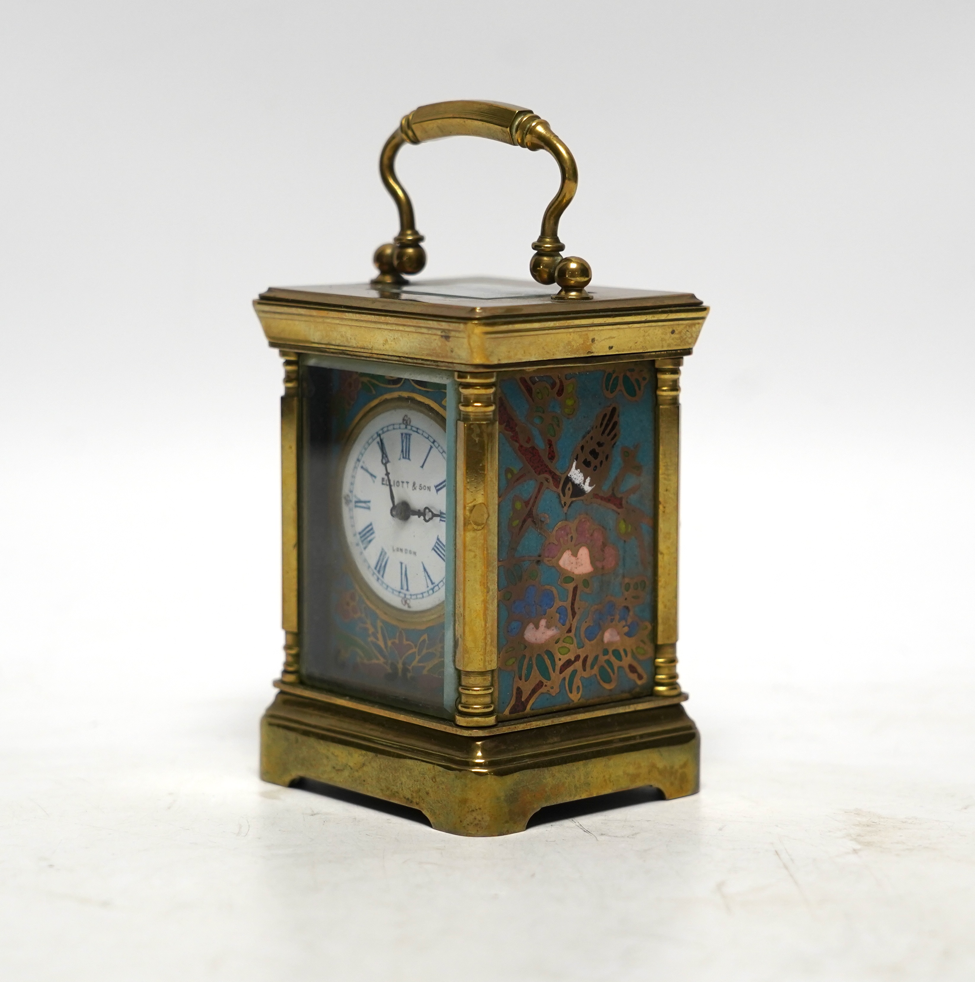 A miniature French brass carriage clock, with champlevé enamel panels, face signed Elliott & Son, London, 8.5cm
